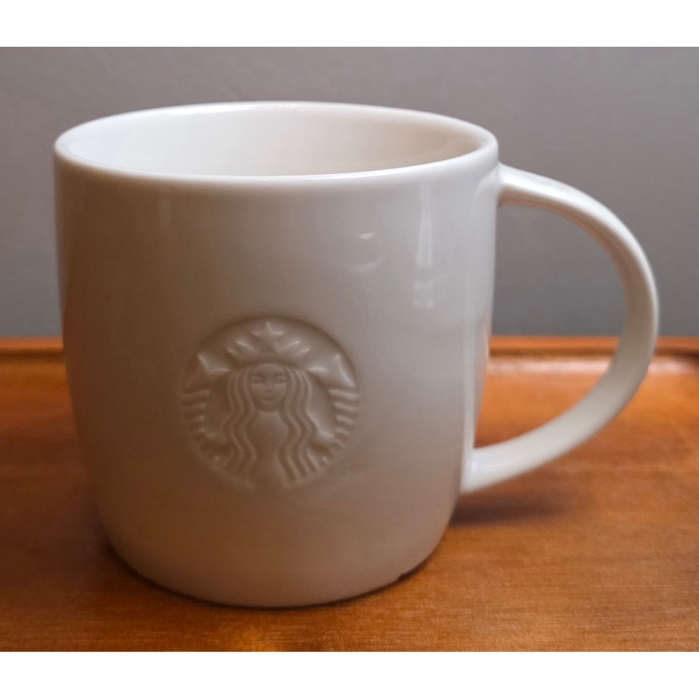 Starbucks 2010 Siren Embossed White Ceramic Coffee Mug Letter S Handle Logo